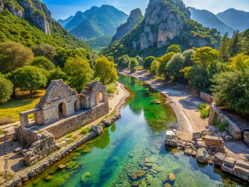 Serene ancient ruins of Olympos nestled in a lush river valley near the Turkish coast, surrounded by majestic mountains and turquoise Mediterranean waters.