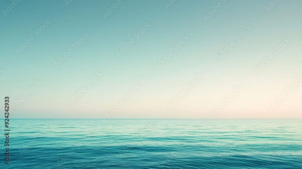 Obraz premium Tranquil ocean meeting pastel sky, creating serene scene. Minimalistic nature beauty captured in seascape, perfect for summer thoughts. Soft focus enhances zen atmosphere with soothing hues blending