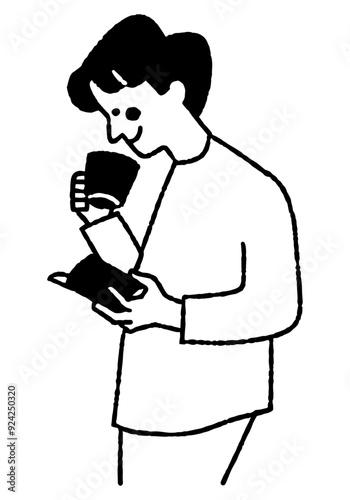 Man reading a book while drinking coffee_2