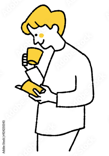 Man reading a book while drinking coffee
