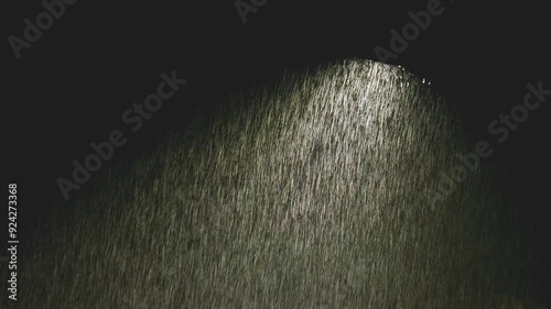 Heavy rain illuminated with street light
