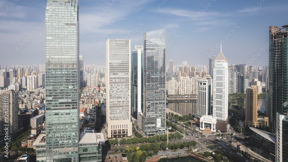 Fototapeta premium Urban Skyline: Modern Architecture and Cityscape Under Blue Sky