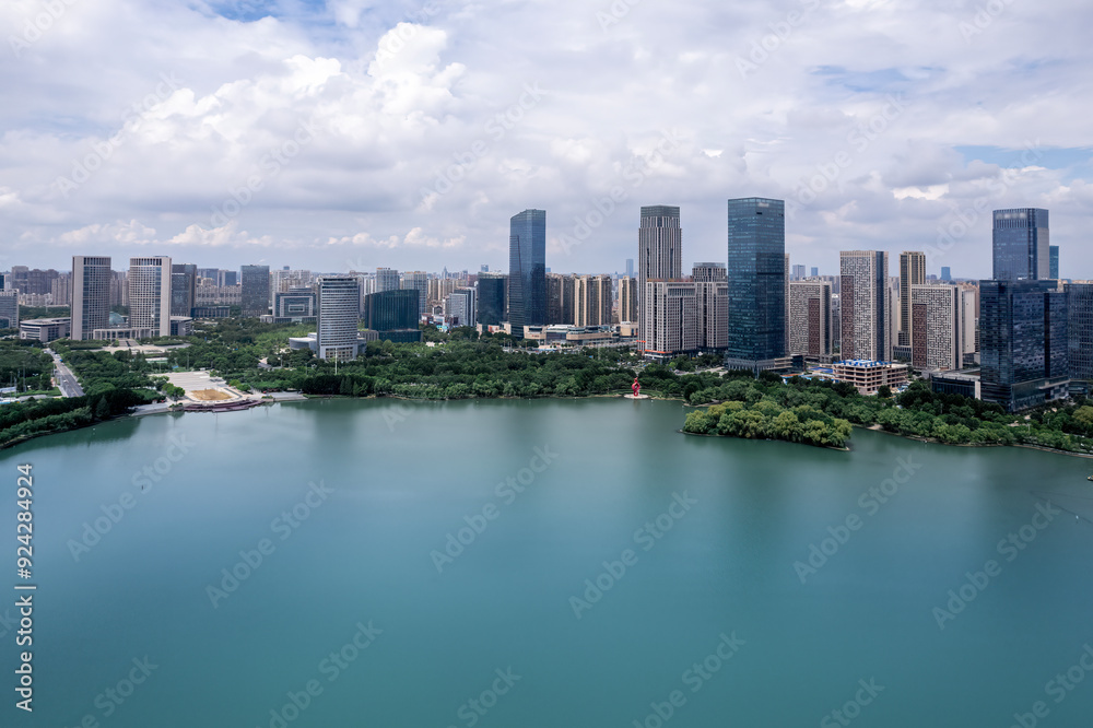 Aerial View of Modern Cityscape with Serene Lakeside Landscape Aerial View of Modern Cityscape with Serene Lakeside Landscape