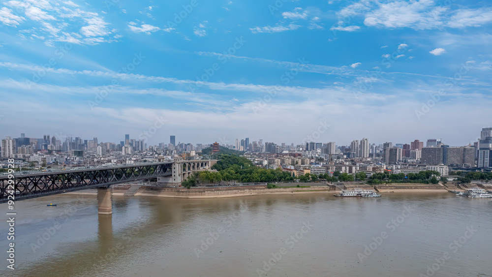 Scenic View of Urban River with Skyline and Bridge Under Clear Blue Sky Scenic View of Urban River with Skyline and Bridge Under Clear Blue Sky