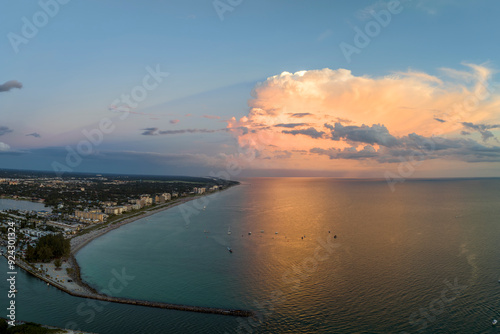 Aerial evening seascape with Nokomis sandy beach in Sarasota County, USA. Many tourists enjoing summer vacation time swimming in warm Mexico gulf water and sunbathing on hot Florida sun