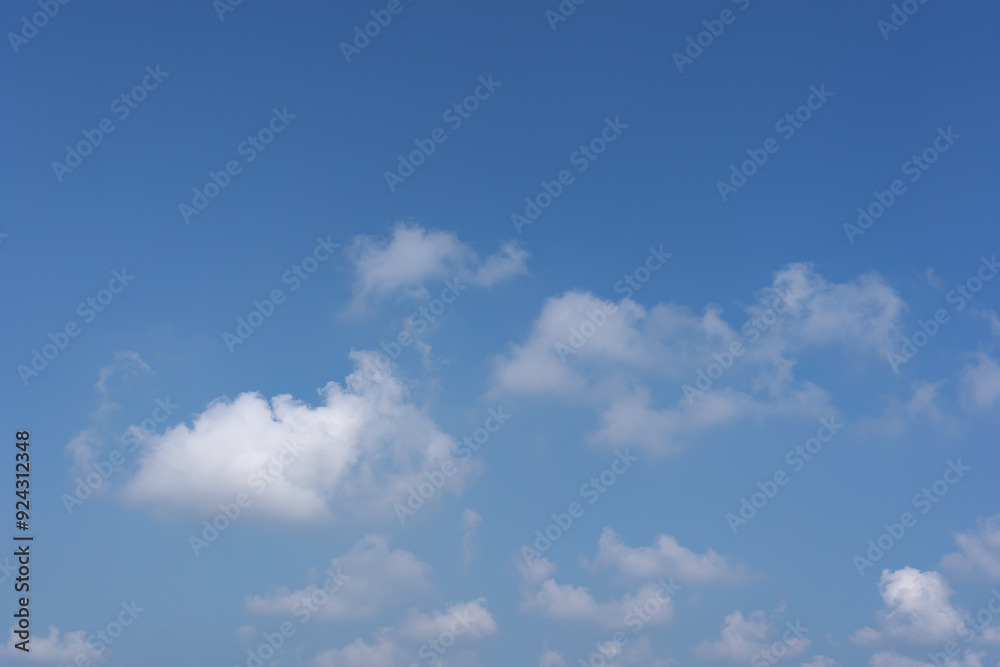 Serene Blue Sky with Fluffy White Clouds Serene Blue Sky with Fluffy White Clouds