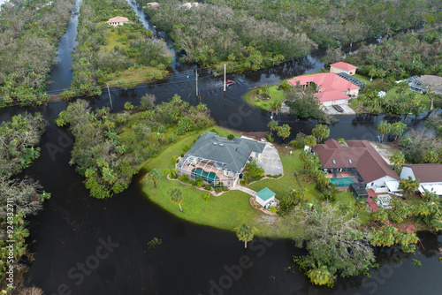 Flooded houses by hurricane Ian rainfall in Florida residential area. Consequences of natural disaster photo