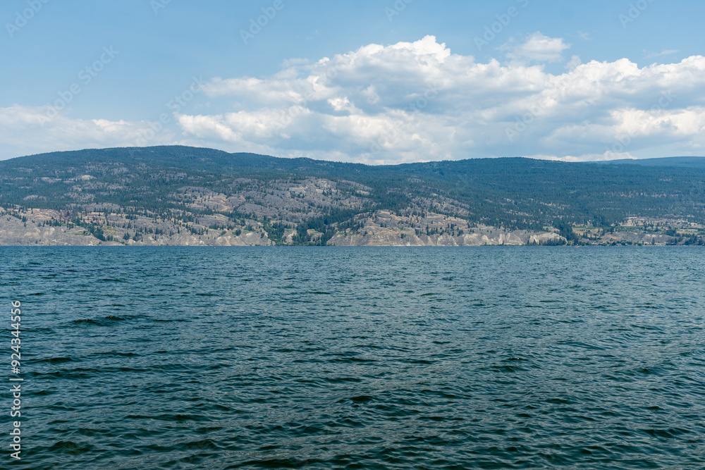summer time July Okanagan Lake British Columbia Canada water landscape sky with clouds summer time July Okanagan Lake British Columbia Canada water landscape sky with clouds