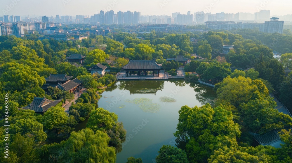 Aerial View of a Serene Chinese Garden with a Pavilion and a Pond Aerial View of a Serene Chinese Garden with a Pavilion and a Pond