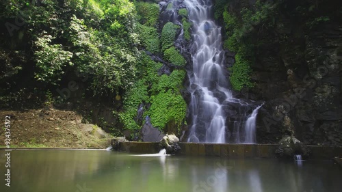 A stunning waterfall in Magelang, Indonesia, featuring a unique elephant statue, blending natural beauty with cultural heritage