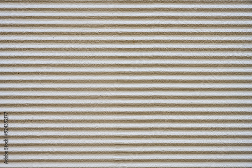 Background from a gray plastered wall with a corrugated profile