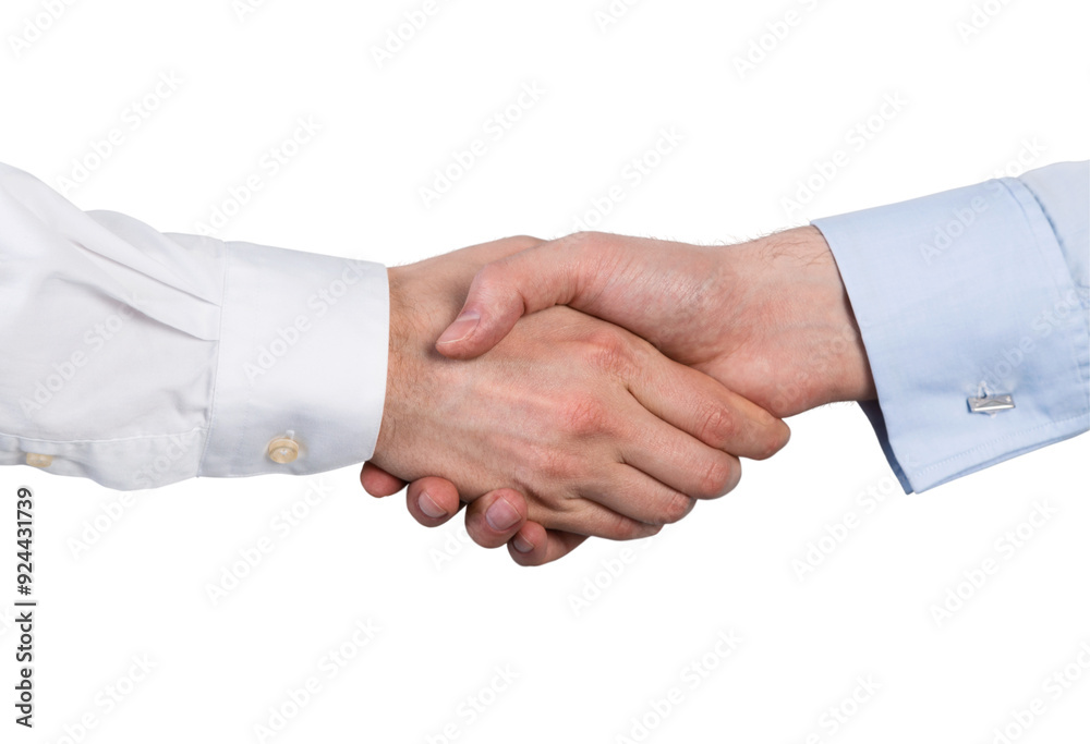 Close-up of two hands shaking, one in white and the other in blue shirt, on a white background. Concept of agreement, partnership, and business collaboration Close-up of two hands shaking, one in white and the other in blue shirt, on a white background. Concept of agreement, partnership, and business collaboration