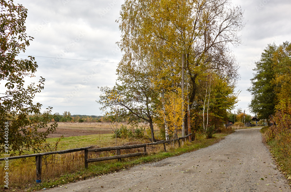 A gravel road at rural Europe. Suburban road path A gravel road at rural Europe. Suburban road path