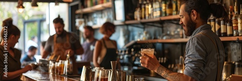 Obraz na płótnie Bartender with tattooed arm holding a cocktail while preparing drinks at a busy bar, surrounded by various bottles and bar tools. w salonie
