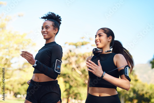 Friends, women and exercise with running at park in happiness for workout and jog in Atlanta. People, runner and smile or confident with fitness for health, wellness and self care on race in forest