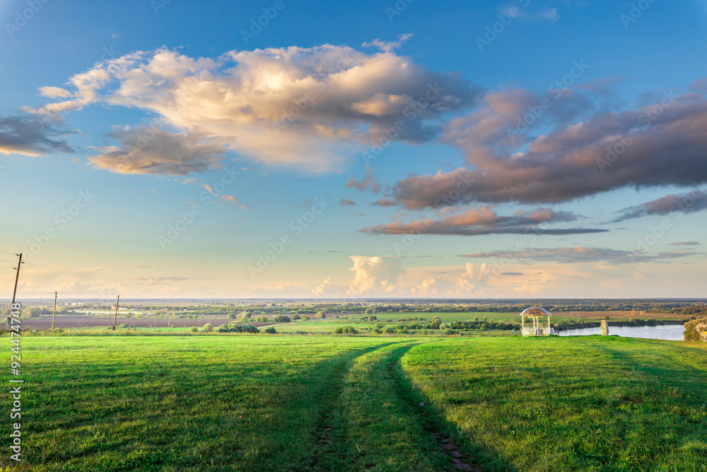 Obraz premium A field of grass with a white path in the middle
