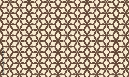 A repeating pattern with abstract geometric flower shapes. The shapes are a brown color on a beige background.