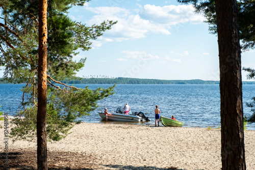 July 2024 Finland Lahti Lake Vesijärvi.Lahti Finland people relaxing on the lake with boats and a motorboat.