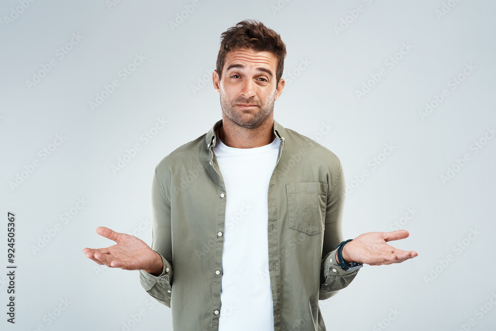 Man, portrait and confused by doubt, option or decision in gray background with hand gesture in studio. Male person, choice and thinking as frustrated consumer, questioning and contemplating for idea Man, portrait and confused by doubt, option or decision in gray background with hand gesture in studio. Male person, choice and thinking as frustrated consumer, questioning and contemplating for idea