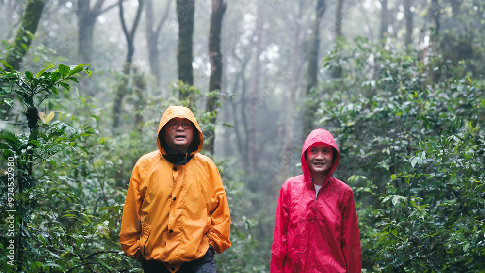 Father and daughter hiking exploring a lush forest Father and daughter hiking exploring a lush forest