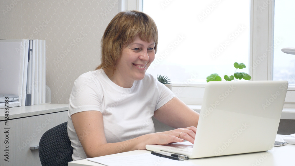 Young Female Freelancer Working on a Computer Young Female Freelancer Working on a Computer