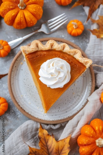 Delicious Slice Of Pumpkin Pie Topped With Whipped Cream Surrounded By Mini P...