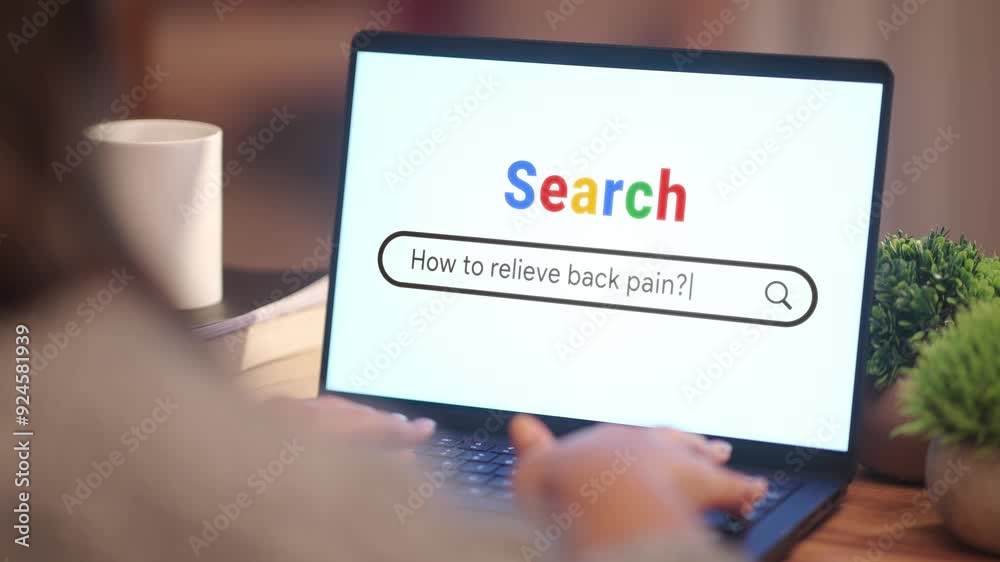 WOMAN SEARCHING HOW TO RELIEVE BACK PAIN? ON INTERNET WOMAN SEARCHING HOW TO RELIEVE BACK PAIN? ON INTERNET