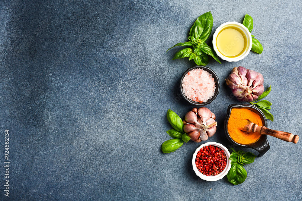 Spices: Oil, salt, fresh garlic and basil, peppercorns in ceramic bowls. Top view. Spices: Oil, salt, fresh garlic and basil, peppercorns in ceramic bowls. Top view.