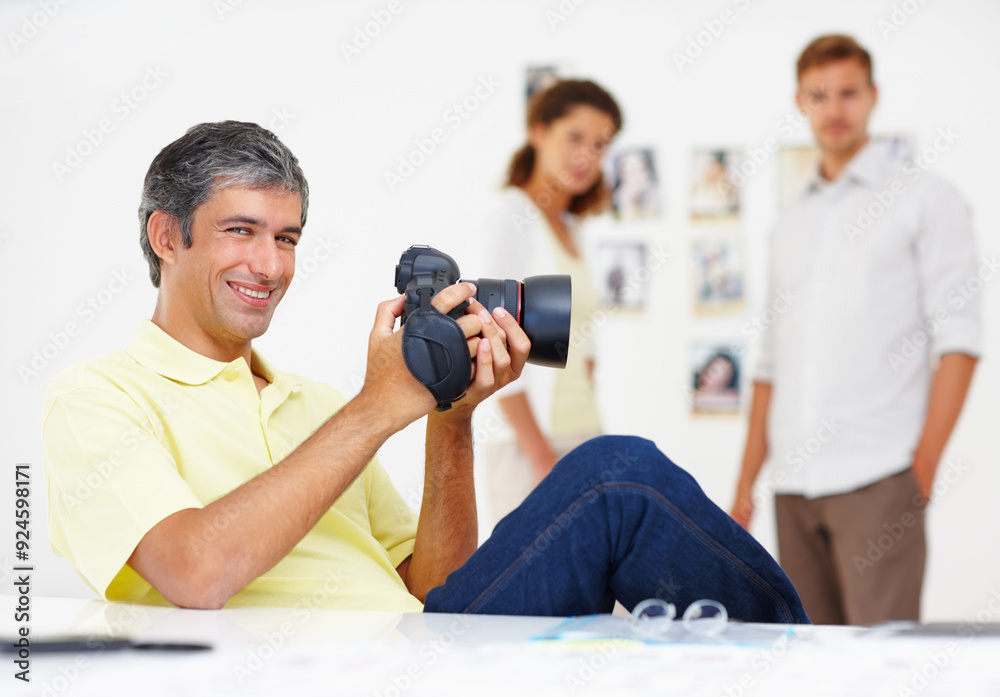 Obraz premium Man, portrait and media photographer in office, review camera picture and creative business. Mature person, planning and feedback on lens in production, editing image and dslr equipment for shoot
