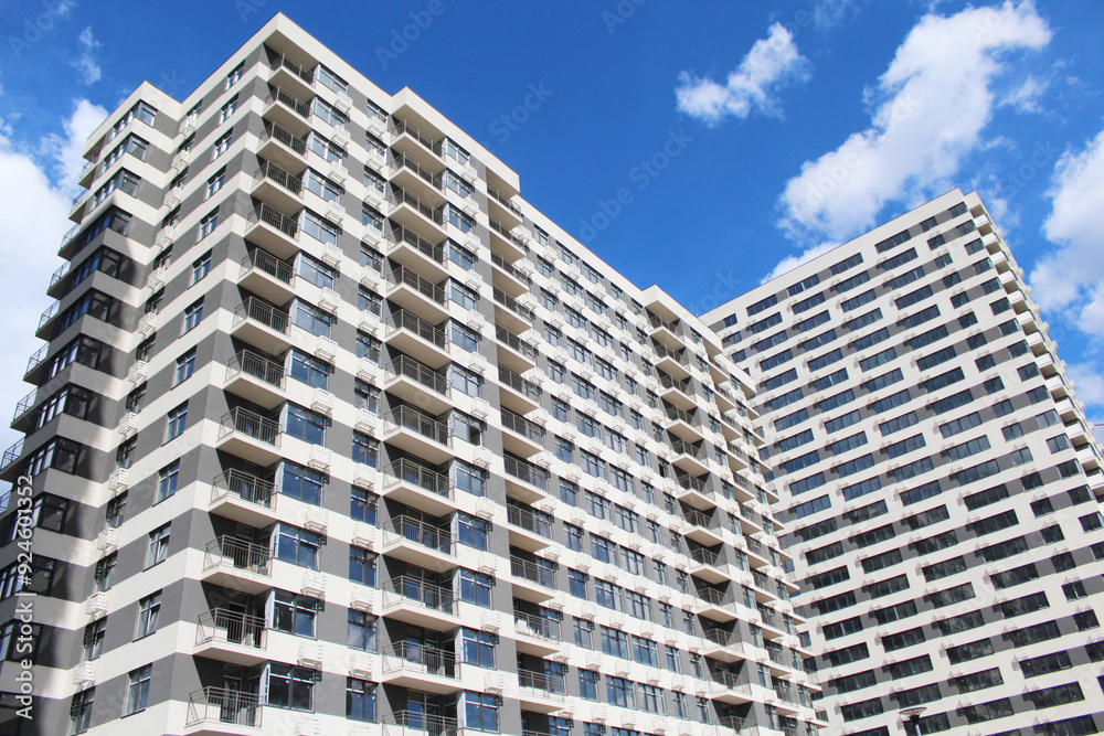 modern apartment building in the city, office building with sky modern apartment building in the city, office building with sky