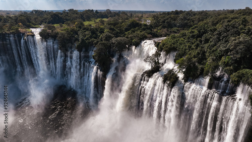 Majestic Kalandula Waterfall cascading in Angola's lush landscape during daytime photo