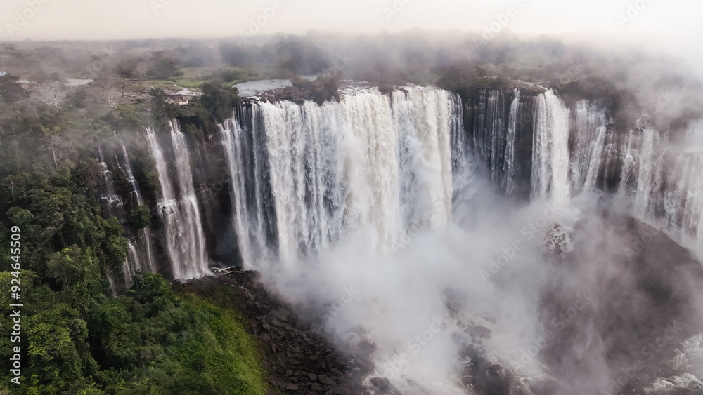 Kalandula Waterfall cascading majestically in Angola amid lush greenery during daylight hours