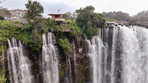 Kalandula Waterfall cascades in Angola, showcasing powerful water flow and surrounding greenery during a serene morning photo