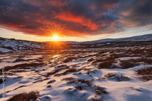 Winter sunrise over snowy landscapes with vibrant skies.