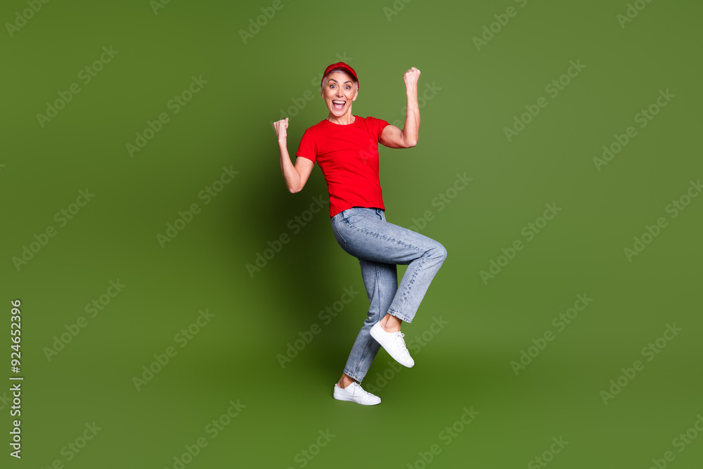 Full body photo of attractive mature woman professional delivery employee win wear red uniform workwear isolated on khaki color background