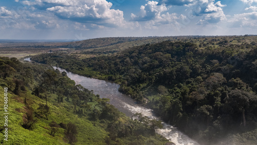 Calandula Waterfall river winding through lush landscape in Angola under a vibrant sky photo