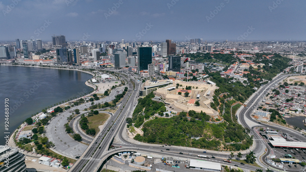 Aerial view of Luanda showcasing coastal landscape, urban development, and the iconic Fort of São Miguel Aerial view of Luanda showcasing coastal landscape, urban development, and the iconic Fort of São Miguel