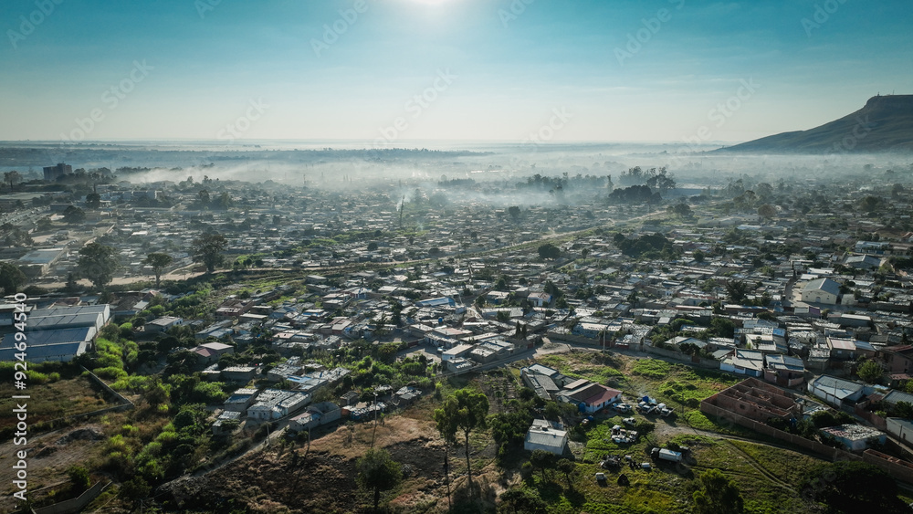 Fototapeta premium Aerial view of Lubango City in Angola during early morning with fog over the landscape