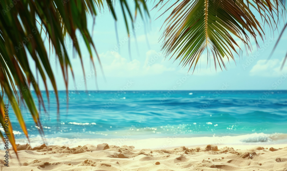 Obraz premium Tropical Beach View Through Palm Fronds
