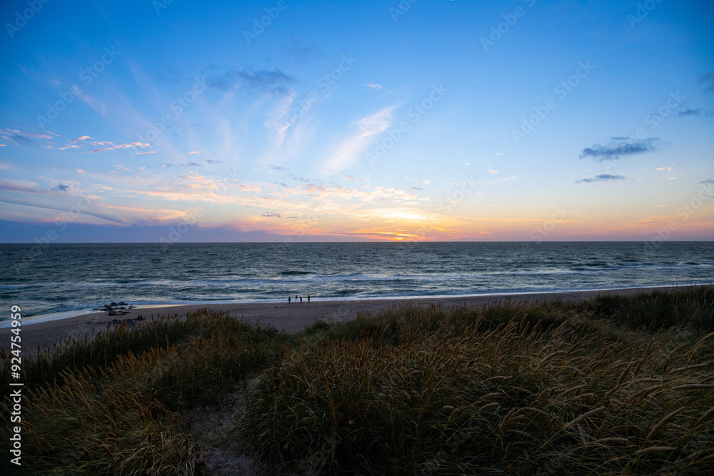 Obraz premium Sunset on the beach of Denmark to the North Sea between dunes