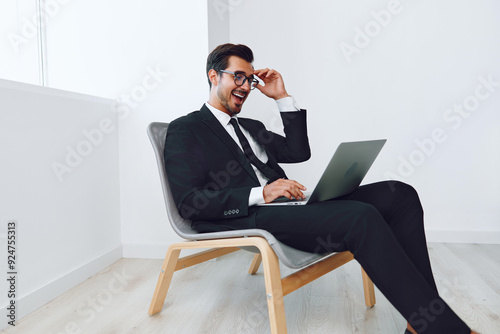 Man laptop technology happy positive gesturing executive business office chair portrait job winner businessman