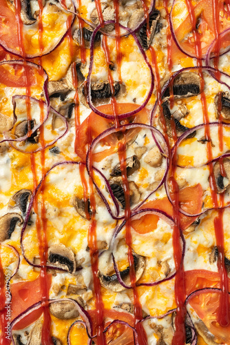 the macro composition of pizza for the menu. fresh ingredients are cheese, ham and tomatoes.