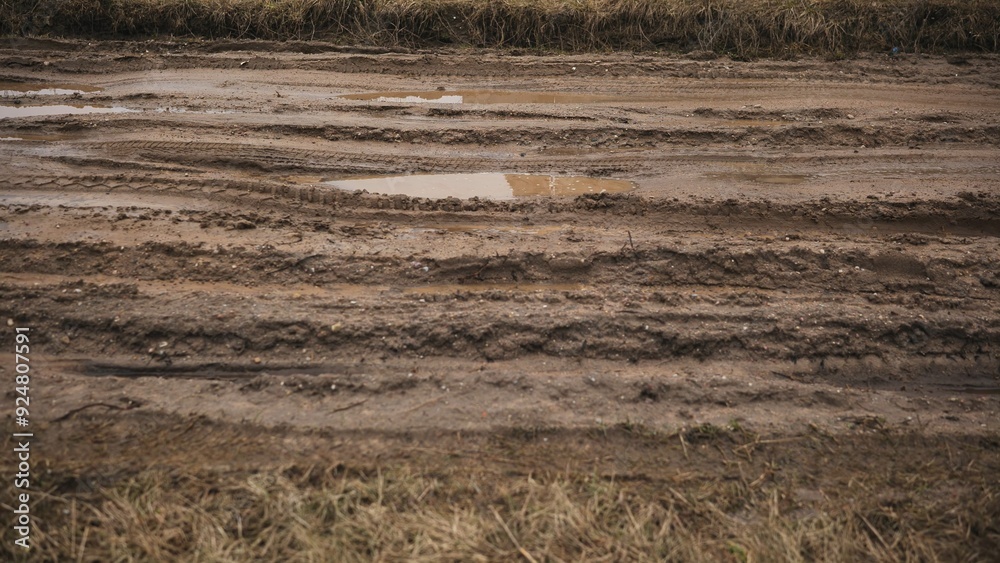 Broken country dirt road with a swamp. Broken country dirt road with a swamp.