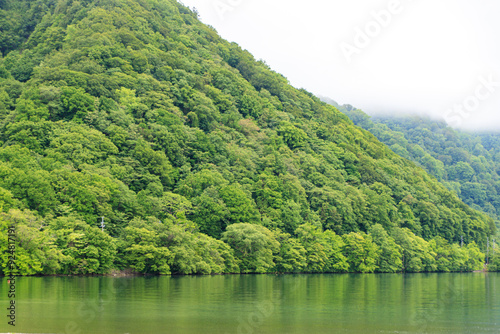 Serene Lake View with Lush Green Hills and Misty Mountain Peaks, Aomori, Japan