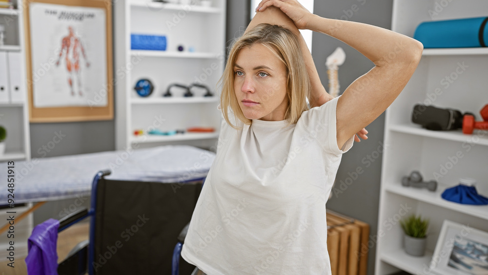 A young attractive caucasian woman poses indoors in a physiotherapy rehabilitation clinic. A young attractive caucasian woman poses indoors in a physiotherapy rehabilitation clinic.