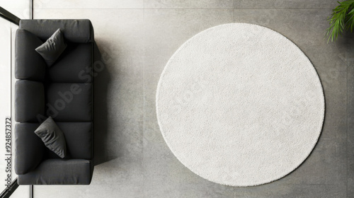 Wallpaper Mural Rug mockup, top view of a round white rug on a grey concrete floor in a modern home interior with a sofa, high-angle shot Torontodigital.ca