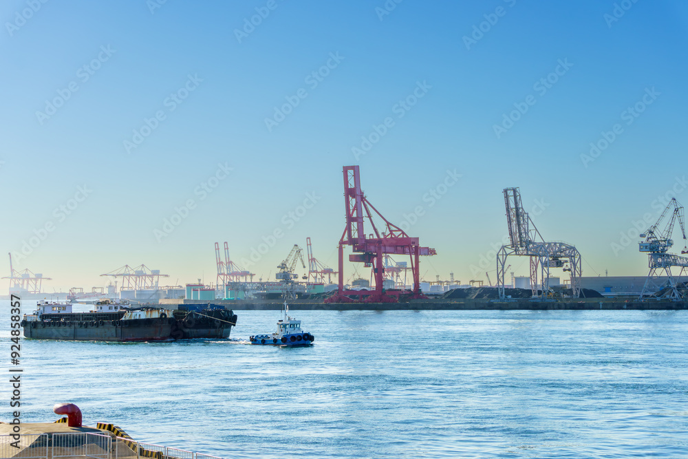 Sailing ships through Osaka port , Marine cargo, large port city and commercial center on the Japanese island of Honshu, Osaka, Japan. Sailing ships through Osaka port , Marine cargo, large port city and commercial center on the Japanese island of Honshu, Osaka, Japan.