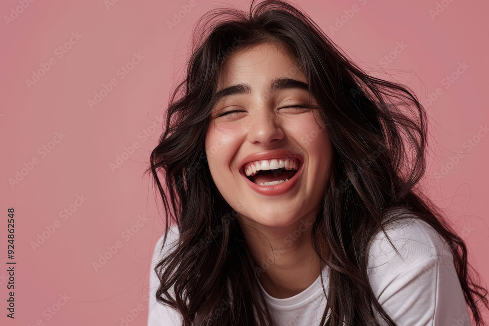 A young Indian ethnic cute girl laughing out of joy A young Indian ethnic cute girl laughing out of joy