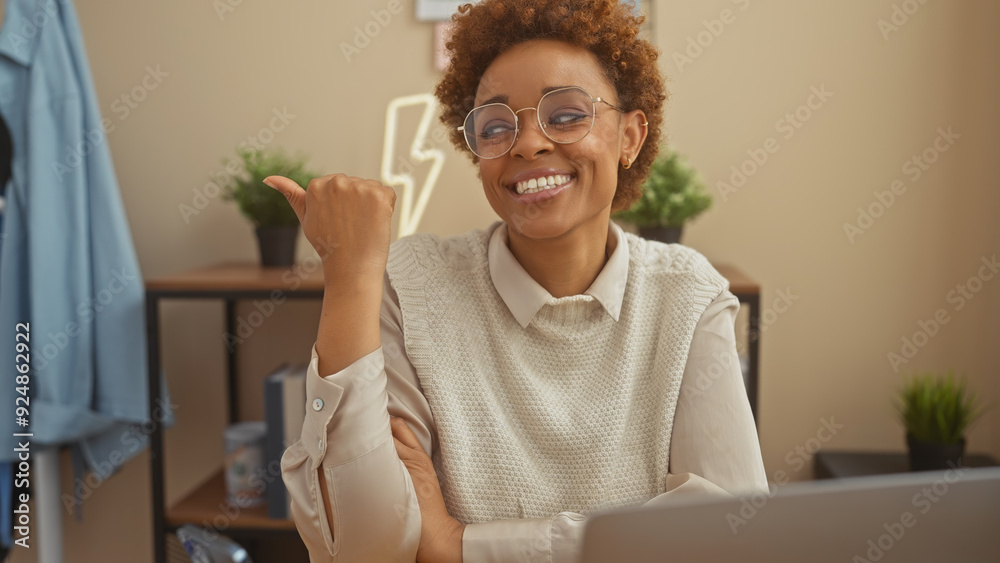 Smiling black woman pointing sideways in a cozy indoor living room, showcasing positive, approachable vibes. Smiling black woman pointing sideways in a cozy indoor living room, showcasing positive, approachable vibes.