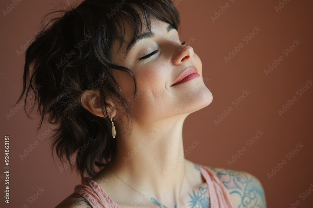 A close up of a woman's face with tattoos and her eyes closed A close up of a woman's face with tattoos and her eyes closed